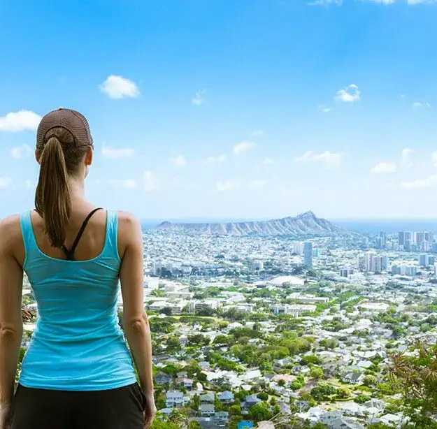 woman looking at Diamond Head from central Oahu