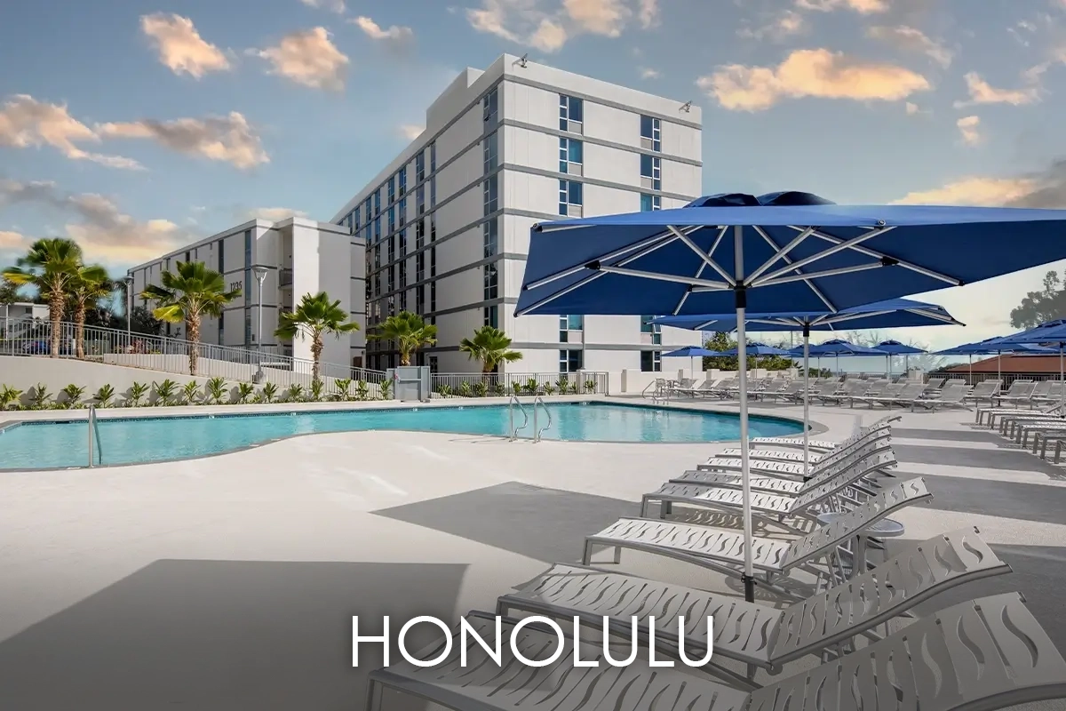 Moananula Hillside Apartments pool view Text says Honolulu